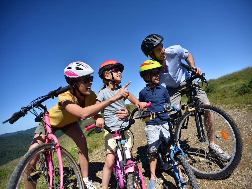 Family of 4 exploring bike trails